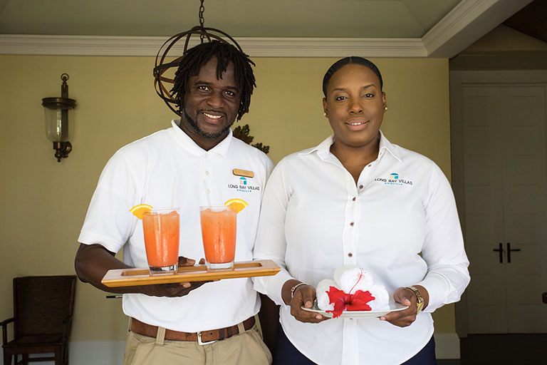 Staff smiling and serving drinks